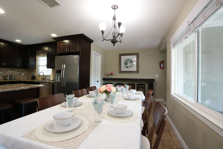 Dining Room and Kitchen. Dining has seating for 10 plus additional seating at bar Dining Room and Kitchen. Dining has seating for 10 plus additional seating at bar