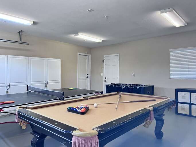 Spacious Game Room With Pool Table, Foosball, And Air Hockey In A Vacation Rental Spacious Game Room With Pool Table, Foosball, And Air Hockey In A Vacation Rental