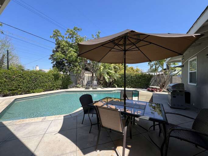 Backyard Bliss Beside Bright Blue Pool At Vacation Rental Backyard Bliss Beside Bright Blue Pool At Vacation Rental
