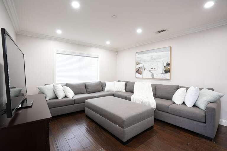 Living Room with an Oversized sectional sofa and queen-size pull-out