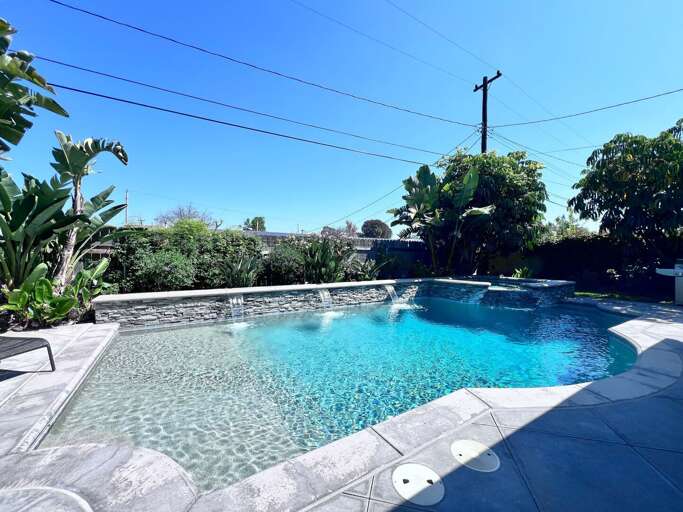 Stunning In-ground Pool and Jacuzzi with Waterfall Features