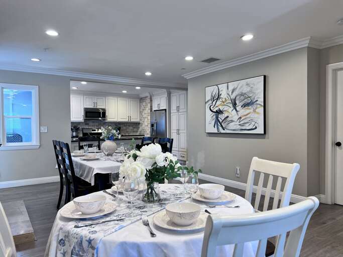 Vacation Rental View: Pristine Place Setting And Polished Kitchen