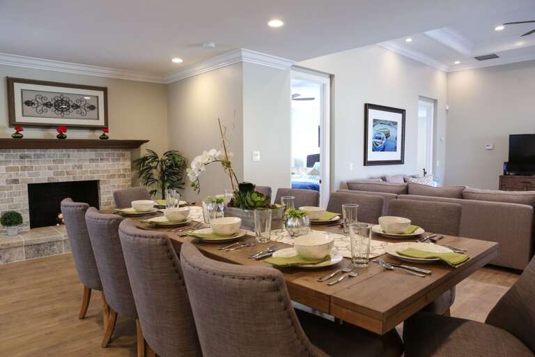 Spacious Living Space With Dining Table Set For Dinner, Neutral Tones Throughout, Adjoining Sitting Area Spacious Living Space With Dining Table Set For Dinner, Neutral Tones Throughout, Adjoining Sitting Area