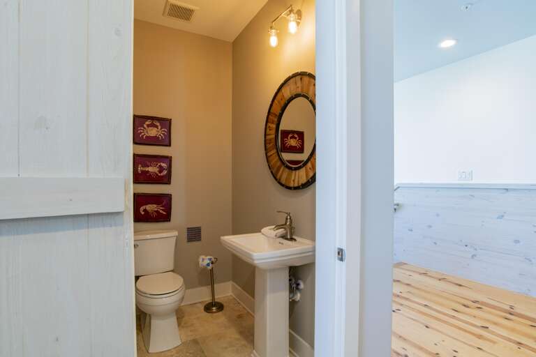 Half bath off 3rd floor den and across hall from bunk room.