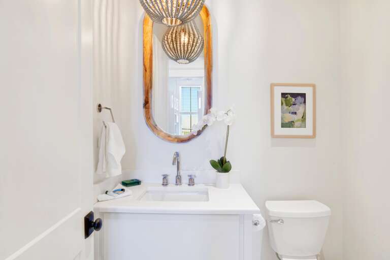 Half bath across from bunk room and off den.