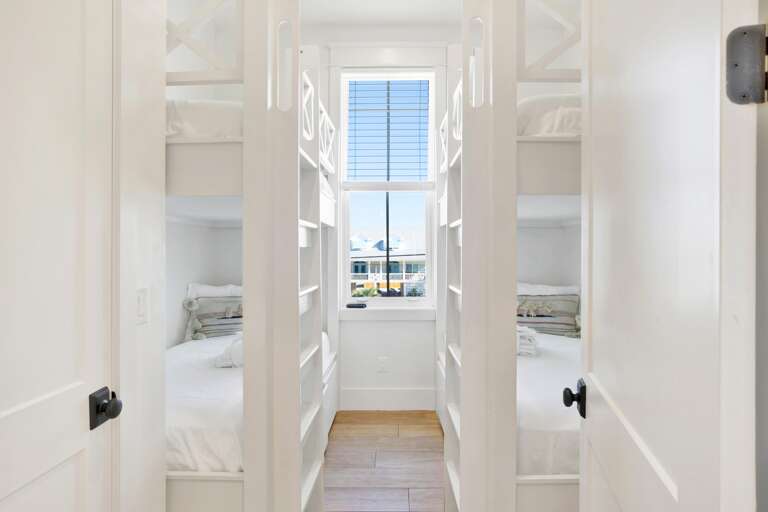 Bunk Room on main level/ first floor. Two sets of Twin XL over Twin XL Bunks. Sleeps 4.