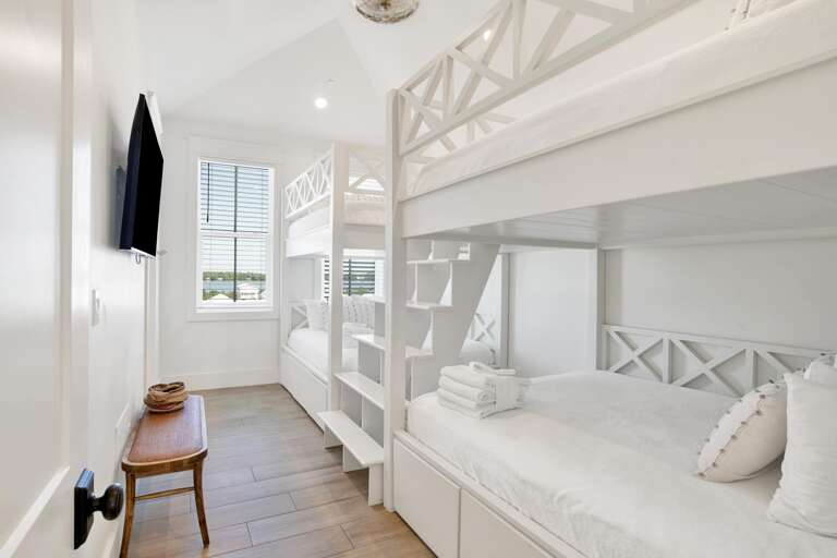 Bedroom 11 features two sets of queen over queen bunks. Sleeps up to 8.