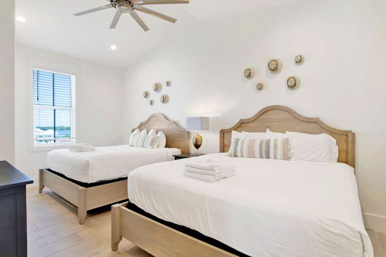 Bedroom on third floor (top floor) with two sets of king beds. Sleeps up to 4.