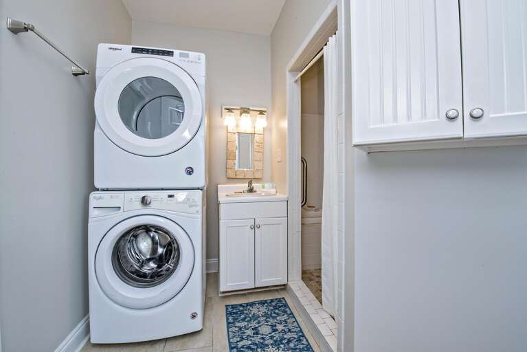 Full Size laundry on main floor beside oversized shower.