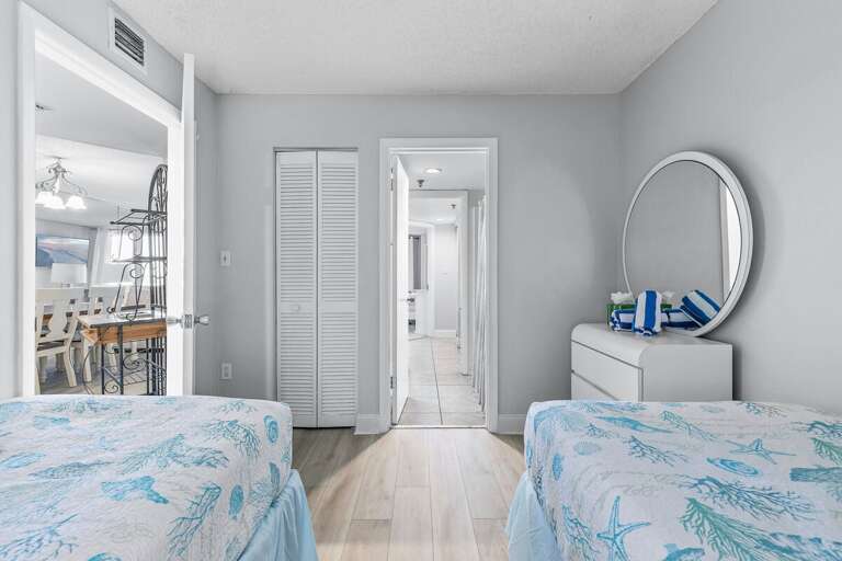 Our twin bedroom condo provides cozy accommodations and easy access to the beach.