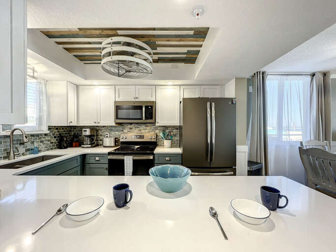 Our breakfast bar provides a perfect spot for casual meals and conversation, with bar stools for added comfort.