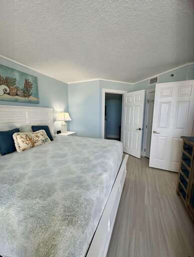 This airy bedroom features calming seafoam tones, a plush king bed, and elegant coastal touches for ultimate comfort and relaxation. This airy bedroom features calming seafoam tones, a plush king bed, and elegant coastal touches for ultimate comfort and relaxation.