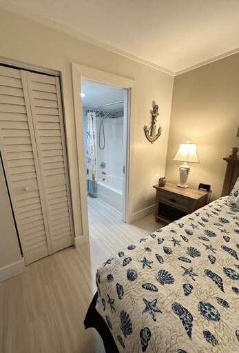 Enjoy the convenience of an ensuite bathroom just steps from your bed, complete with nautical décor and cozy lighting. Enjoy the convenience of an ensuite bathroom just steps from your bed, complete with nautical décor and cozy lighting.