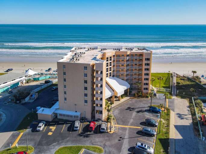 Discover the beauty from above! Enjoy stunning aerial views of the main oceanfront building, surrounded by coastal splendor. Discover the beauty from above! Enjoy stunning aerial views of the main oceanfront building, surrounded by coastal splendor.