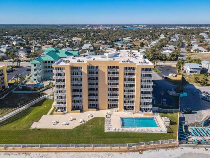 Discover the beauty from above! Enjoy stunning aerial views of the main oceanfront building, surrounded by coastal splendor. Discover the beauty from above! Enjoy stunning aerial views of the main oceanfront building, surrounded by coastal splendor.