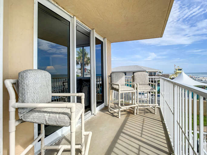Step onto the balcony and take in the breathtaking views of the pool and ocean. Step onto the balcony and take in the breathtaking views of the pool and ocean.