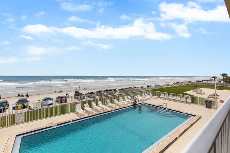Step onto the balcony and take in the breathtaking views of the pool and ocean. Step onto the balcony and take in the breathtaking views of the pool and ocean.