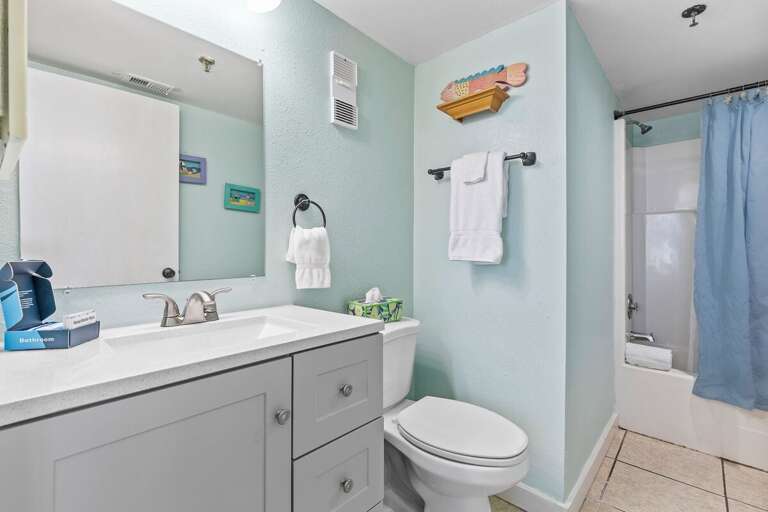 Unwind in comfort! The guest bathroom boasts a tub/shower combo for a relaxing bathing experience. Unwind in comfort! The guest bathroom boasts a tub/shower combo for a relaxing bathing experience.