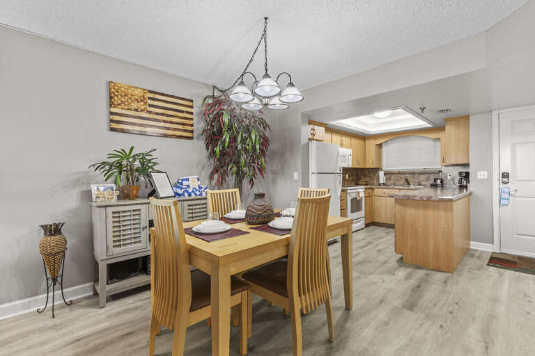 Entertain with ease! The spacious dining table area provides ample space for enjoyable meals and gatherings.