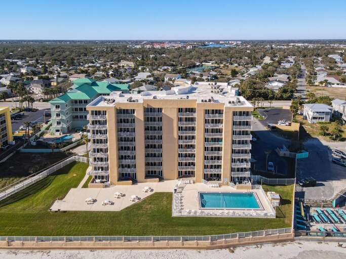 Elevate your experience with a bird's-eye view of our stunning oceanfront building and its surrounding beauty.