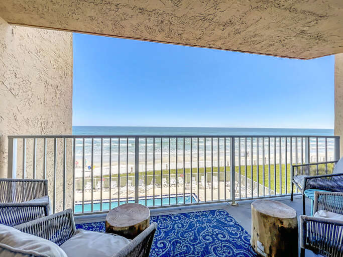 Balcony overlooking the pool and beach. Balcony overlooking the pool and beach.