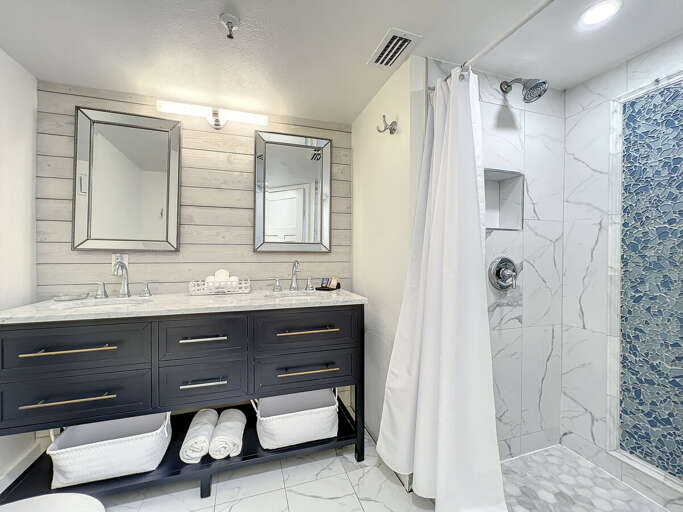 Double sided sink with new vanity. Walk in shower. Double sided sink with new vanity. Walk in shower.