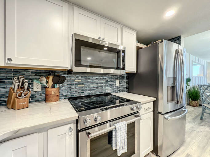 Flat top stove, microwave and full size fridge. Flat top stove, microwave and full size fridge.