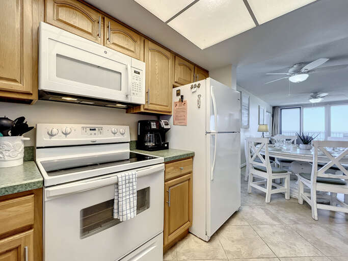 Flat stop stove, microwave and full size fridge.