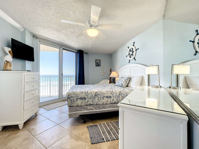 Mounted tv and access to balcony from master.