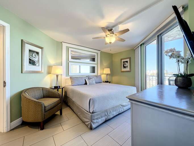 King bed with views of the balcony.