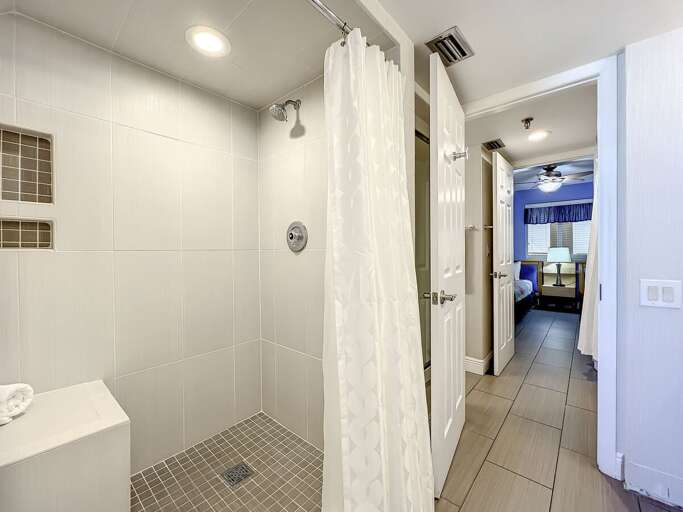 Walk in shower. Access to guest bathroom.