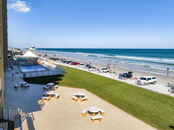Picnic tables with view of beach.