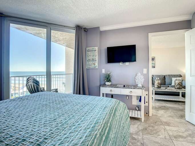 Mounted TV. Access to balcony.