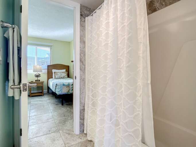 Shower tub combination. Access to guest room.