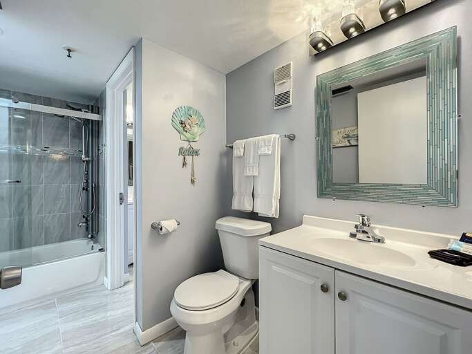 Vanity with storage. Shower tub combination.