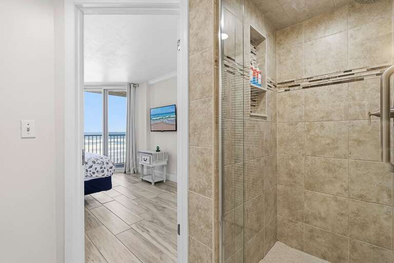 Refresh during your beach stay in this modern bathroom with a spacious walk-in shower and stylish