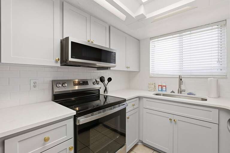 This beach stay offers a clean, modern kitchen with stainless steel appliances, ample counter space,