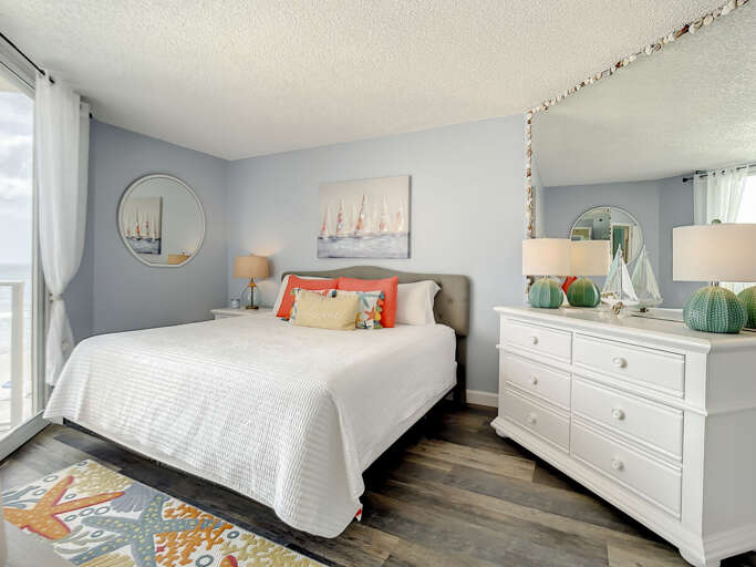 King size bed with dresser for storage.