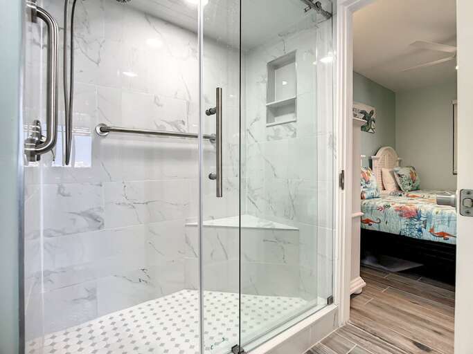 Walk in shower with access to guest room.
