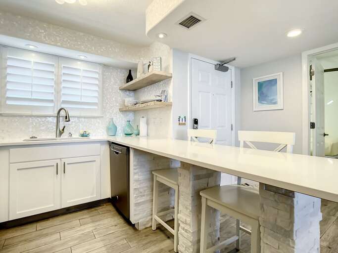 Breakfast bar with extra seating. Breakfast bar with extra seating.