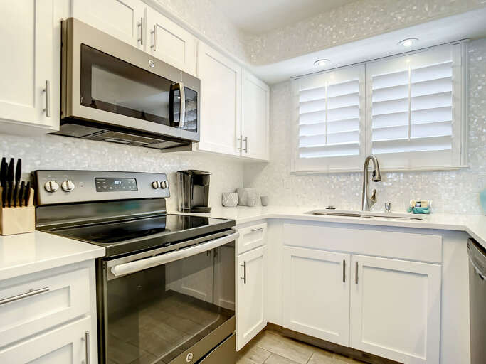 Flat top stove and microwave. Flat top stove and microwave.