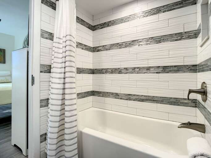 Shower tub combination. Access to guest bedroom. Shower tub combination. Access to guest bedroom.