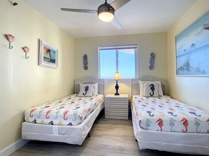 2 Twin beds with nightstand.