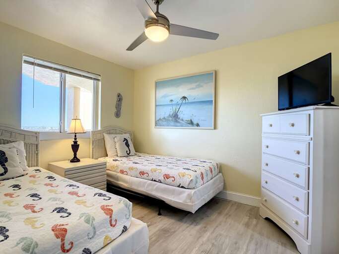 Dressers with storage. Ceiling fan and flat screen TV.