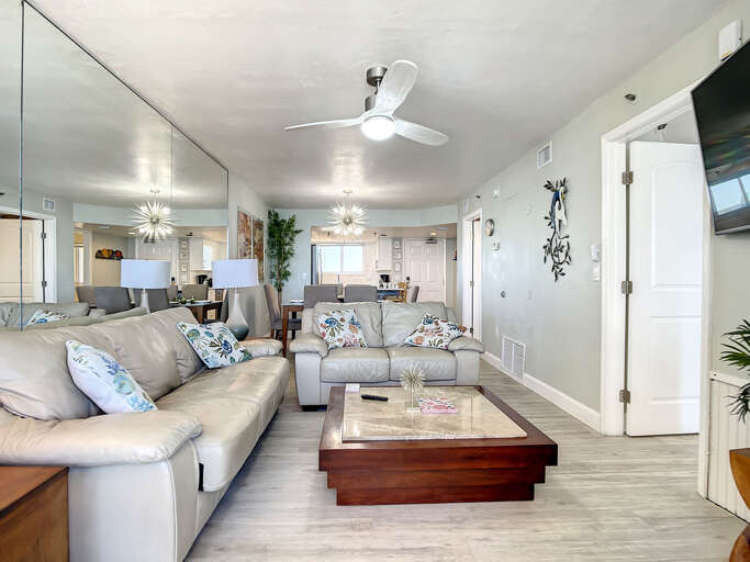 Mounted tv. Views into the kitchen.