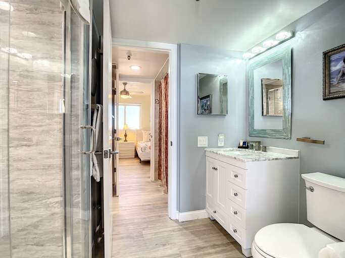 Walk in shower. Vanity with storage. Access to guest bathroom.