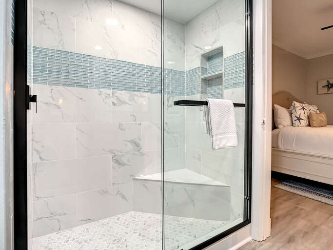 Walk in shower. Access to guest room.