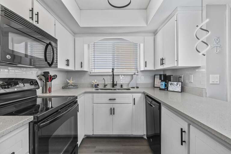 With ample counter space and a functional layout, this kitchen is both practical and elegant, ideal for meal prep and casual dining. With ample counter space and a functional layout, this kitchen is both practical and elegant, ideal for meal prep and casual dining.