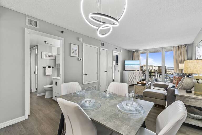 This bright and airy open-concept living and dining area offers a perfect blend of comfort and This bright and airy open-concept living and dining area offers a perfect blend of comfort and