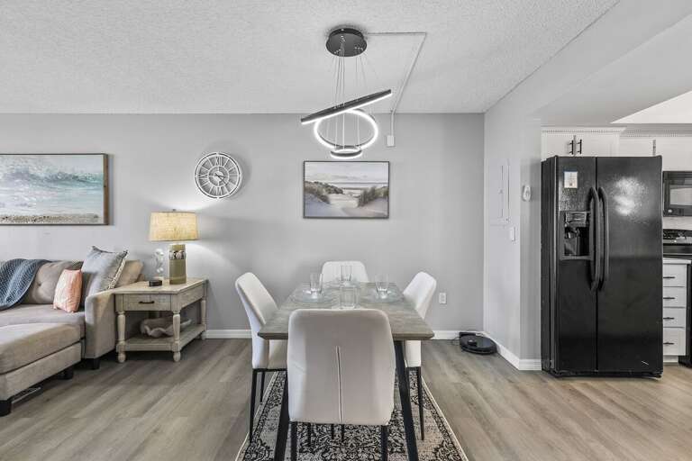 The dining area flows seamlessly into the adjacent living room and kitchen, offering an open-plan layout perfect for entertaining or casual meals. The dining area flows seamlessly into the adjacent living room and kitchen, offering an open-plan layout perfect for entertaining or casual meals.